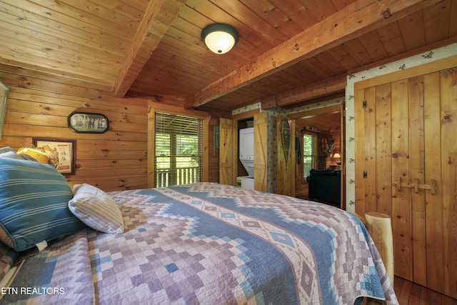 2389 Misty Ln, Sevierville, TN 37876 - bedroom with wooden walls, a wooden ceiling with exposed beams, and wood finished floors