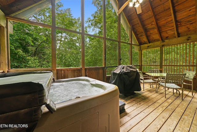 2389 Misty Ln, Sevierville, TN 37876 - sunroom with a hot tub, outdoor dining area, and a ceiling fan