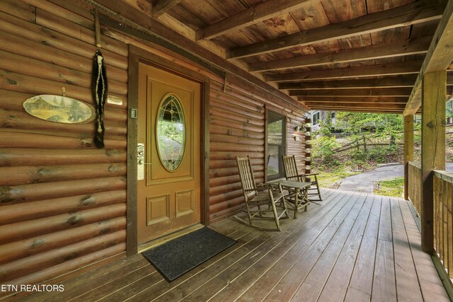 2389 Misty Ln, Sevierville, TN 37876 - view of exterior entry with log exterior and a porch