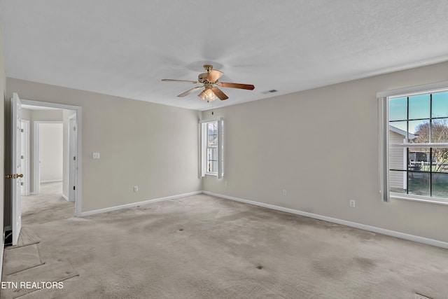 1670 Maremont Rd, Knoxville, TN 37918 - unfurnished room featuring a ceiling fan, healthy amount of natural light, and light carpet