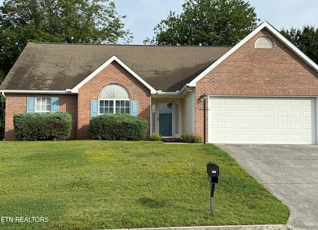1670 Maremont Rd, Knoxville, TN 37918 - ranch-style house featuring brick siding, roof with shingles, driveway, a garage, and a front lawn
