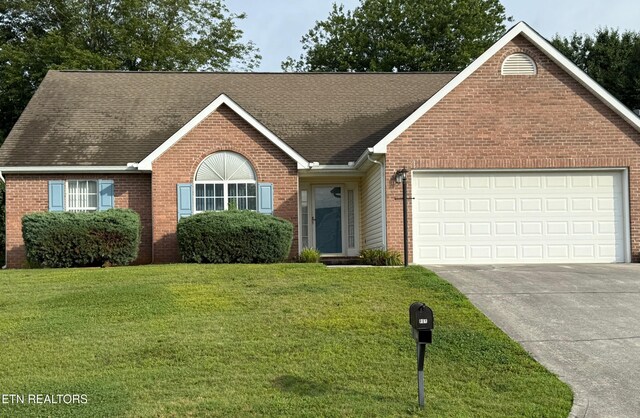 1670 Maremont Rd, Knoxville, TN 37918 - ranch-style house with brick siding, roof with shingles, driveway, and a garage