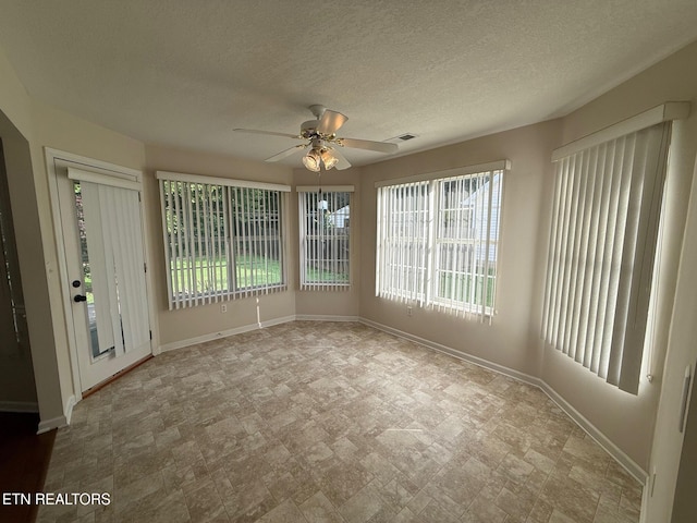 1670 Maremont Rd, Knoxville, TN 37918 - unfurnished room featuring healthy amount of natural light and a ceiling fan