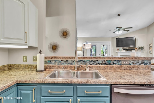 8824 Carriage House Way, Knoxville, TN 37923 - kitchen with dishwasher, ceiling fan, blue cabinets, white cabinets, and vaulted ceiling