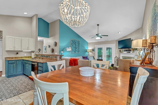8824 Carriage House Way, Knoxville, TN 37923 - dining area with high vaulted ceiling, ceiling fan, a chandelier, and light tile patterned floors