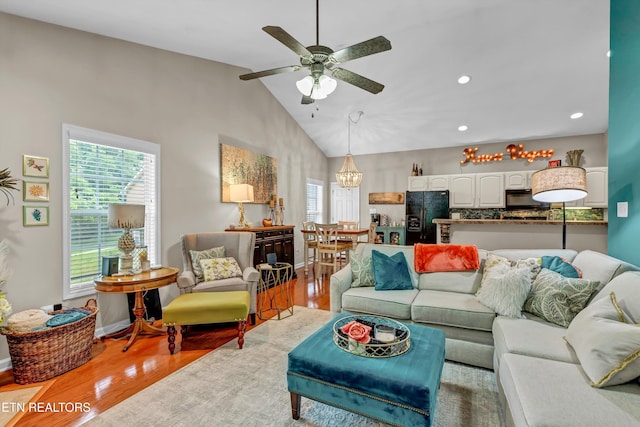 8824 Carriage House Way, Knoxville, TN 37923 - living room with wood finished floors, ceiling fan, a chandelier, recessed lighting, and high vaulted ceiling
