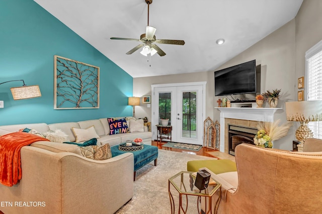 8824 Carriage House Way, Knoxville, TN 37923 - living room featuring lofted ceiling, a ceiling fan, a tiled fireplace, french doors, and recessed lighting