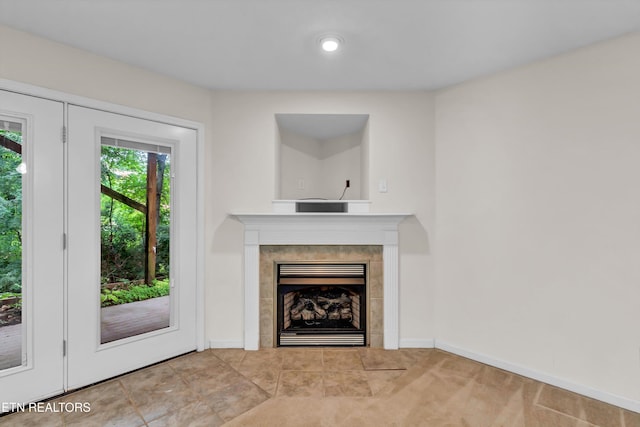 8824 Carriage House Way, Knoxville, TN 37923 - unfurnished living room featuring a tile fireplace and baseboards