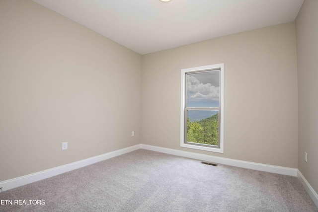 2609 Mountain Blvd, Sevierville, TN 37876 - spare room featuring carpet and baseboards