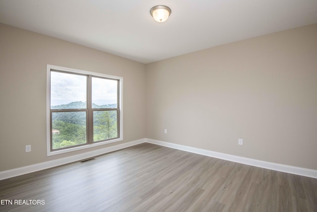 2609 Mountain Blvd, Sevierville, TN 37876 - unfurnished room featuring wood finished floors and baseboards