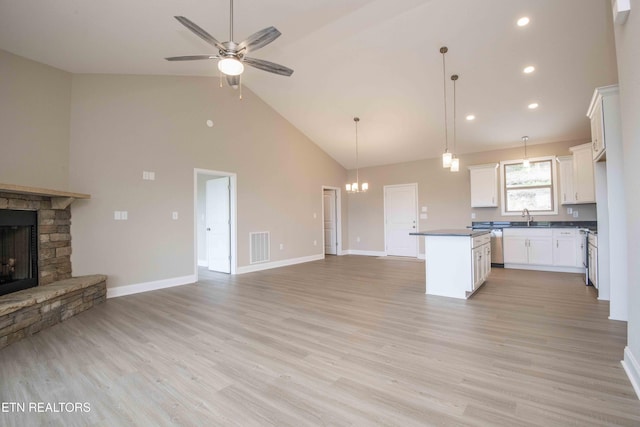 2609 Mountain Blvd, Sevierville, TN 37876 - kitchen with open floor plan, high vaulted ceiling, dark countertops, a center island, and a ceiling fan