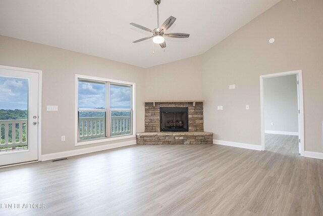 2609 Mountain Blvd, Sevierville, TN 37876 - unfurnished living room with light wood-type flooring, a ceiling fan, a fireplace, and high vaulted ceiling