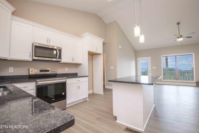2609 Mountain Blvd, Sevierville, TN 37876 - kitchen featuring appliances with stainless steel finishes, light wood-style floors, white cabinetry, ceiling fan, and pendant lighting