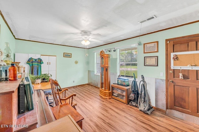 225 Spring St, Spring City, TN 37381 - home office with light wood-type flooring, crown molding, and a ceiling fan