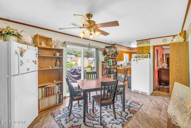 225 Spring St, Spring City, TN 37381 - dining room with ceiling fan, a textured ceiling, and crown molding