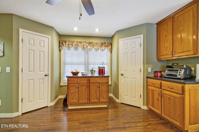 1096 Circle Dr, Jamestown, TN 38556 - kitchen featuring dark countertops, dark wood finished floors, ceiling fan, brown cabinetry, and recessed lighting