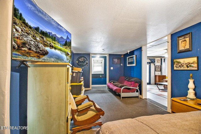 1096 Circle Dr, Jamestown, TN 38556 - carpeted bedroom featuring a textured ceiling and baseboards