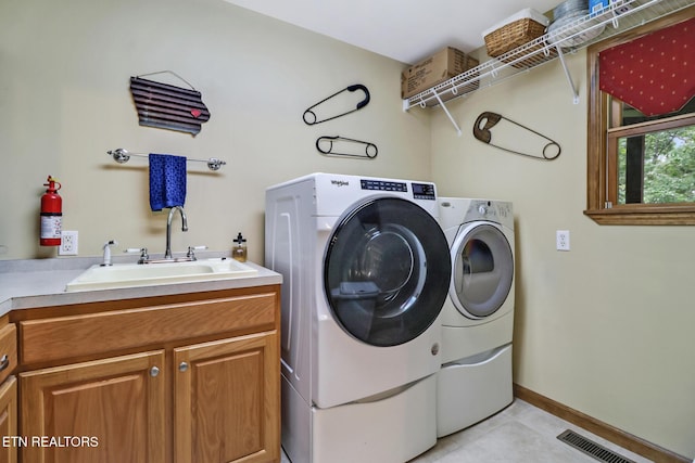 41 Crest Pl, Monterey, TN 38574 - washroom with cabinet space, washing machine and clothes dryer, and light tile patterned floors