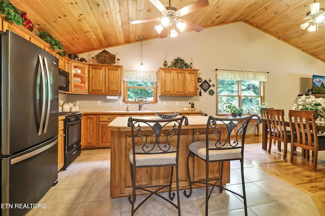 41 Crest Pl, Monterey, TN 38574 - kitchen featuring black appliances, ceiling fan, vaulted ceiling, wood ceiling, and light tile patterned flooring