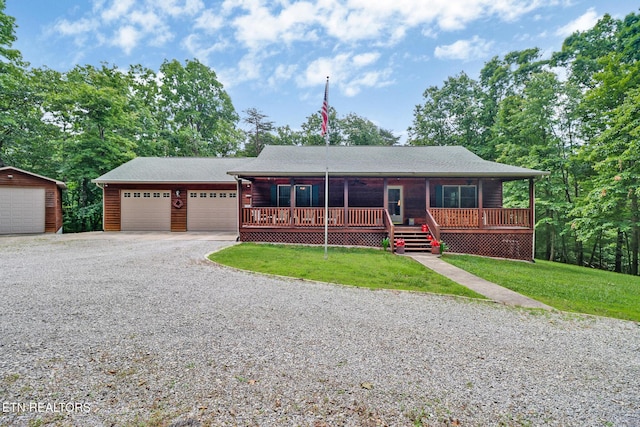 41 Crest Pl, Monterey, TN 38574 - view of front of home featuring a front lawn, an attached garage, driveway, and a porch