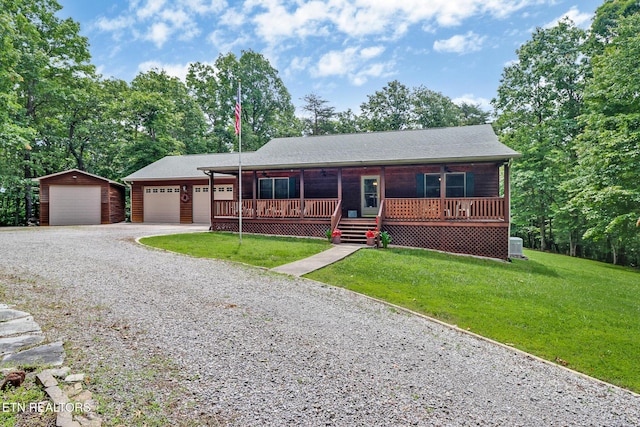 41 Crest Pl, Monterey, TN 38574 - ranch-style home with a front lawn, an outdoor structure, gravel driveway, and a porch