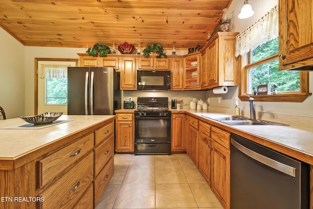 41 Crest Pl, Monterey, TN 38574 - kitchen with black appliances, wooden ceiling, light countertops, plenty of natural light, and brown cabinets