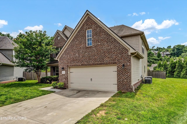 2017 Gusty Wind Ln, Knoxville, TN 37932 - traditional home with brick siding, concrete driveway, and an attached garage