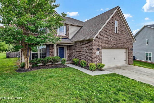 2017 Gusty Wind Ln, Knoxville, TN 37932 - traditional-style house with brick siding, driveway, a garage, and a front lawn