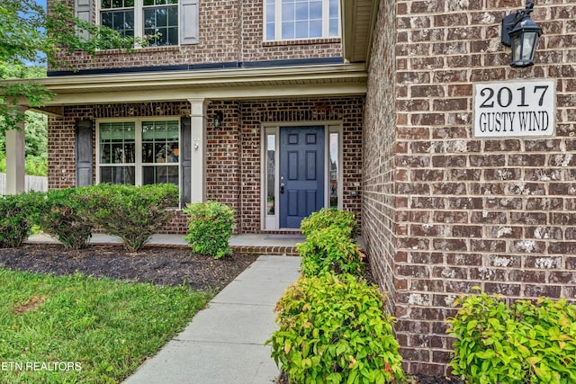 2017 Gusty Wind Ln, Knoxville, TN 37932 - doorway to property featuring brick siding and covered porch