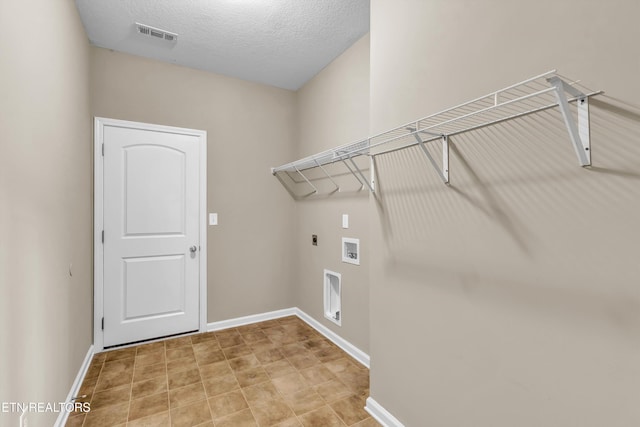 2017 Gusty Wind Ln, Knoxville, TN 37932 - laundry area featuring electric dryer hookup, hookup for a washing machine, and a textured ceiling