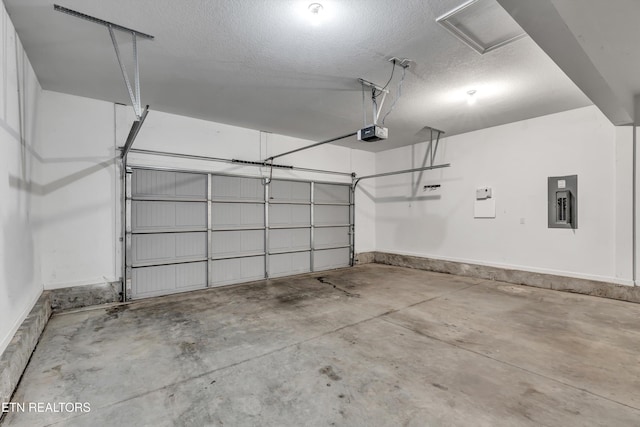 2017 Gusty Wind Ln, Knoxville, TN 37932 - garage featuring electric panel and a garage door opener