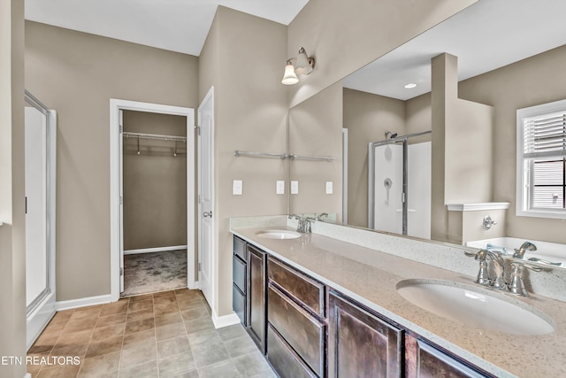 2017 Gusty Wind Ln, Knoxville, TN 37932 - full bathroom featuring a stall shower, a walk in closet, double vanity, and a bath