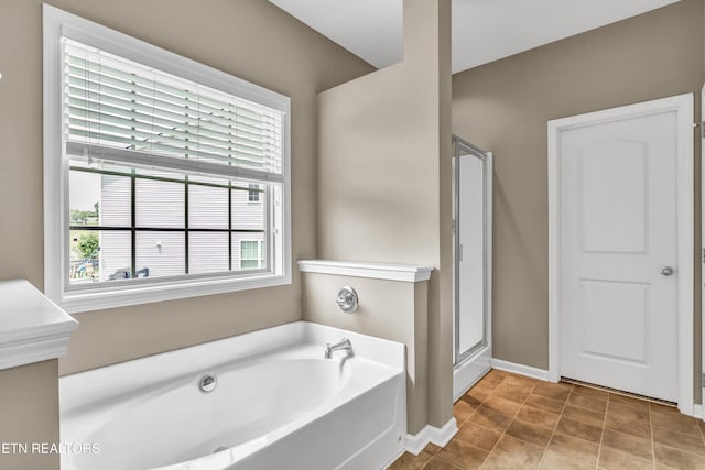 2017 Gusty Wind Ln, Knoxville, TN 37932 - bathroom with a bath and a stall shower