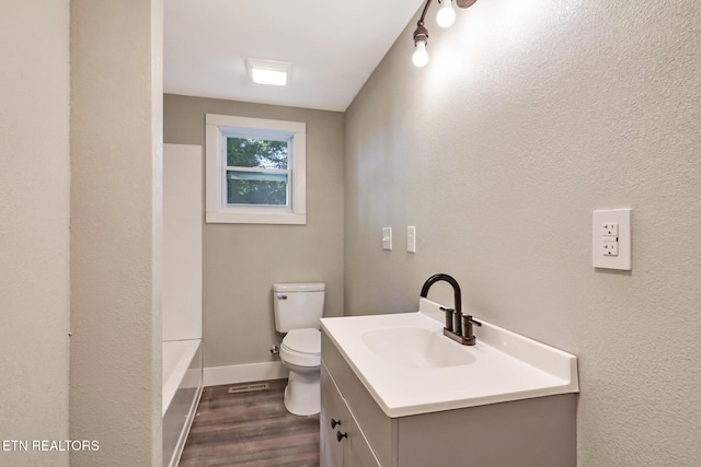 1700 E 1st St, Crossville, TN 38555 - full bath with wood finished floors, vanity, and bathing tub / shower combination