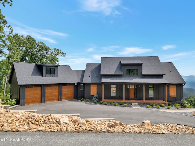 1848 Mountain Ash Way, Sevierville, TN 37876 - view of front of property with board and batten siding, roof with shingles, covered porch, a garage, and driveway