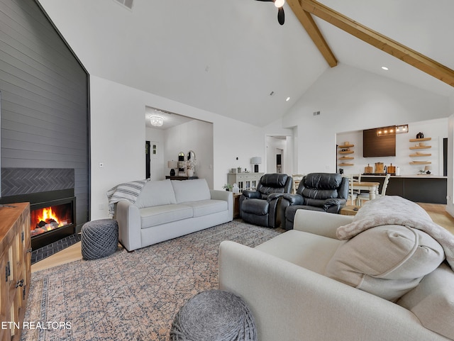 1848 Mountain Ash Way, Sevierville, TN 37876 - living area with high vaulted ceiling, beamed ceiling, a fireplace, wood finished floors, and a ceiling fan