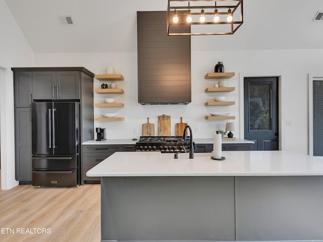 1848 Mountain Ash Way, Sevierville, TN 37876 - kitchen with open shelves, high quality fridge, range, light wood finished floors, and ventilation hood