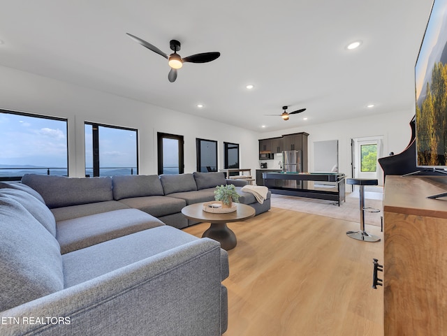 1848 Mountain Ash Way, Sevierville, TN 37876 - living room featuring a ceiling fan, recessed lighting, and light wood-style flooring