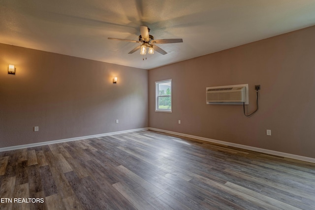 150 Ray Cross Rd, Harriman, TN 37748 - spare room featuring a wall mounted air conditioner, a ceiling fan, and dark wood-type flooring