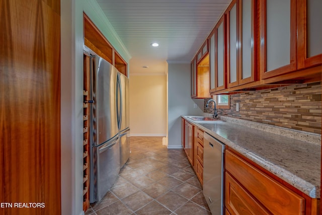 150 Ray Cross Rd, Harriman, TN 37748 - kitchen featuring stainless steel appliances, tasteful backsplash, crown molding, brown cabinetry, and glass insert cabinets