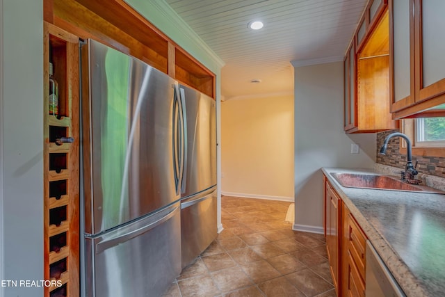 150 Ray Cross Rd, Harriman, TN 37748 - kitchen with freestanding refrigerator, brown cabinets, ornamental molding, backsplash, and recessed lighting