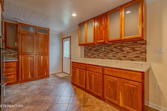 150 Ray Cross Rd, Harriman, TN 37748 - kitchen with decorative backsplash, wooden ceiling, light stone countertops, glass insert cabinets, and brown cabinetry