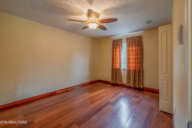150 Ray Cross Rd, Harriman, TN 37748 - empty room featuring a textured ceiling, a ceiling fan, and wood finished floors