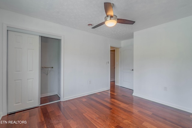 150 Ray Cross Rd, Harriman, TN 37748 - unfurnished bedroom with wood finished floors, a closet, a textured ceiling, and ceiling fan
