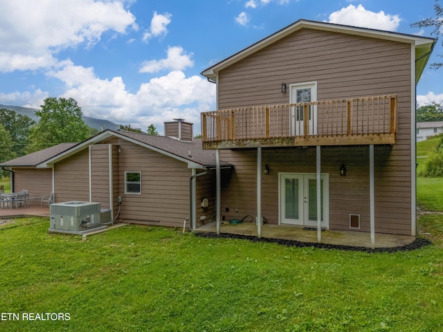 150 Ray Cross Rd, Harriman, TN 37748 - rear view of house featuring french doors, a patio area, and a lawn