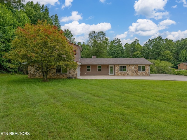 150 Ray Cross Rd, Harriman, TN 37748 - view of front of house featuring stone siding, a front lawn, and a chimney