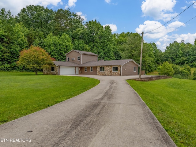 150 Ray Cross Rd, Harriman, TN 37748 - view of front of property with asphalt driveway, stone siding, a front lawn, and a view of trees