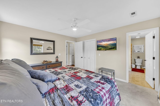 3183 Wears Dr, Sevierville, TN 37862 - bedroom featuring light colored carpet, ceiling fan, connected bathroom, and a closet
