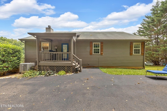 3183 Wears Dr, Sevierville, TN 37862 - view of front of house featuring covered porch and a chimney