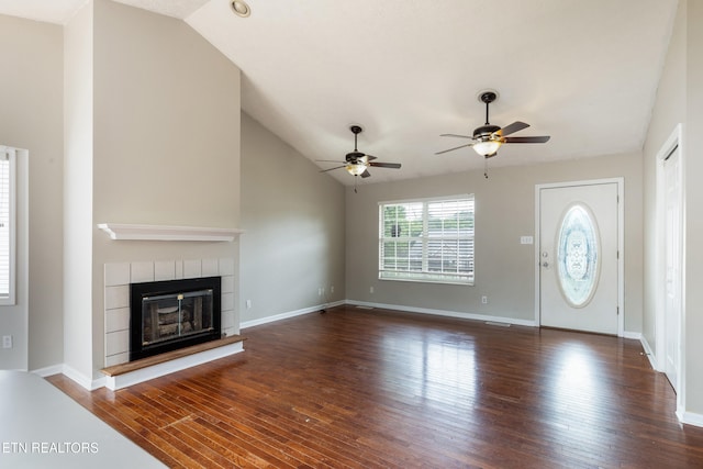 541 Pebble Creek Rd, Knoxville, TN 37918 - unfurnished living room with hardwood / wood-style flooring, ceiling fan, a tile fireplace, and vaulted ceiling
